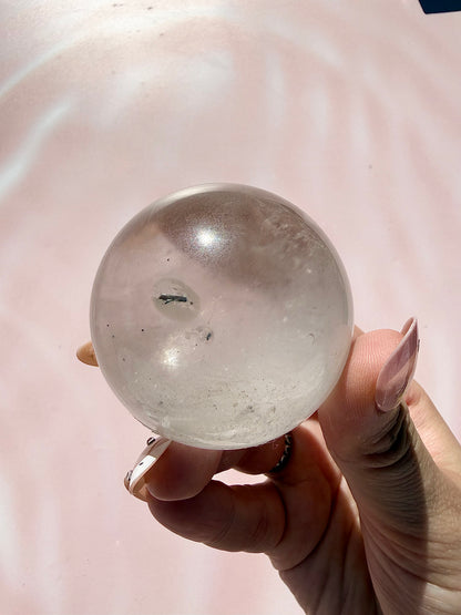 Clear Quartz Sphere with Black Tourmaline Inclusion